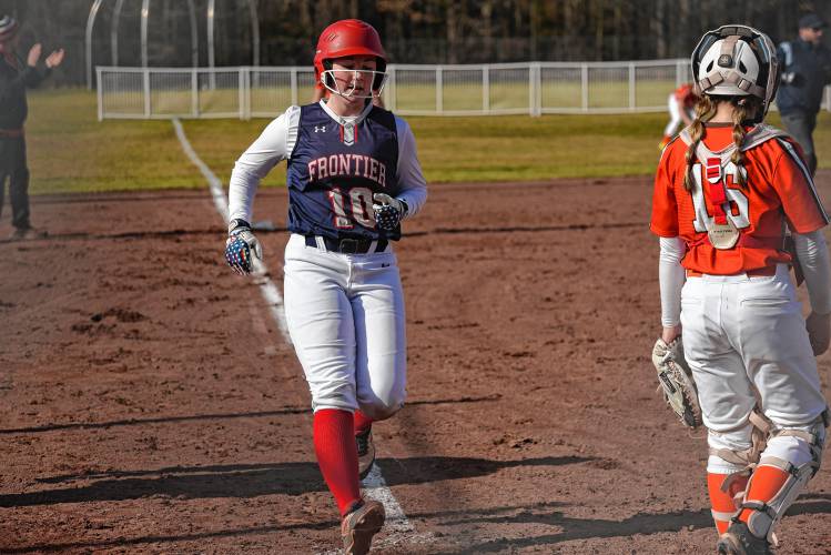 Frontier’s Skyler Steele (10) heads home to score a run against Agawam during the Redhawks’ season opener on Friday at Zabek Field in South Deerfield.