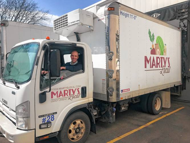 Nick Martinelli, CEO of Marty’s Local, in one of the company’s fleet trucks.