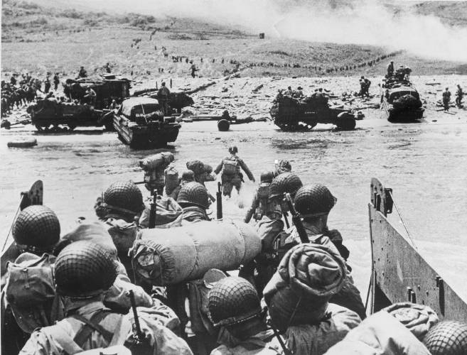 American soldiers and supplies arrive on the shore of the French coast of German-occupied Normandy during the Allied D-Day invasion on June 6, 1944 in World War II. Nearly 160,000 Allied troops landed in Normandy on June 6, 1944. Of those, 73,000 were from the United States, 83,000 from Britain and Canada. Forces from several other countries were also involved, including French troops fighting with Gen. Charles de Gaulle. The Allies faced around 50,000 German forces.