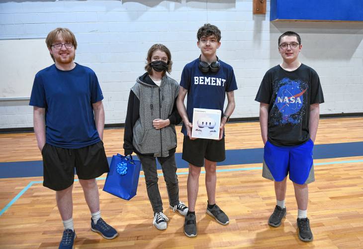 Matthew Richards, Danielle Walker, Dakota Santos and Theo Shahan are some of the Franklin County Technical School students helping Gill-Montague Senior Center members with their electronic devices.