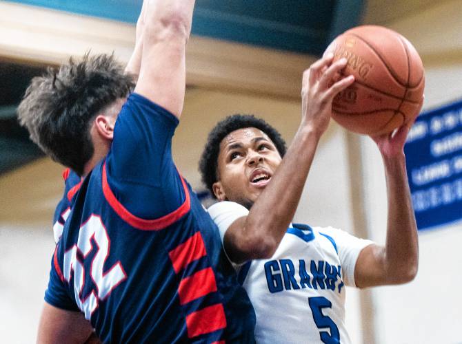 Granby's Gavier Fernandez (5) attempts a layup during the PVIAC Class C tournament semifinal game against Mahar at Granby High School, Tuesday, Feb. 18, 2025, in Granby.
