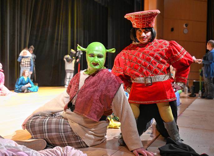 Michael Waite as Shrek and Mario Pareja as Lord Farquaad of Turners Falls High School and Great Falls Middle School’s production of “Shrek the Musical.”