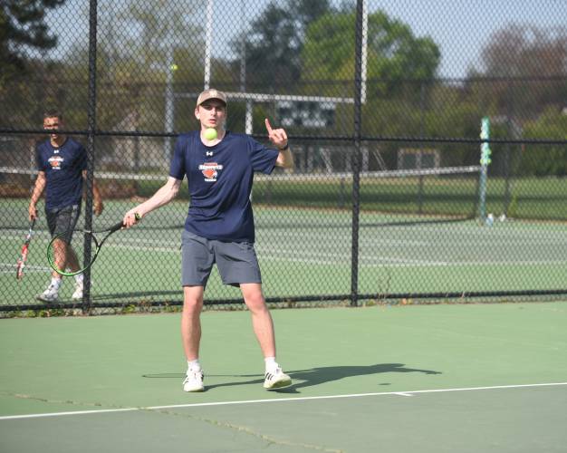 Frontier's Oliver Brown returns a volley against Greenfield at the Davis Street Courts Friday. 