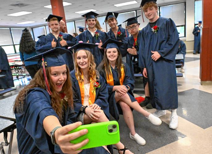 Frontier Senior Hailey Hutkoski takes a group selfie prior to Frontier Regional School graduation on Friday Night in South Deerfield.