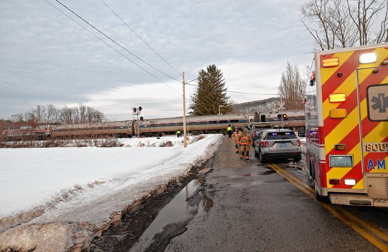 An Amtrak train is stopped across the Pleasant Street railroad crossing where an adult was struck by the northbound train on Monday afternoon.
