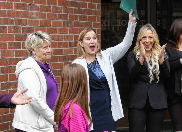 Greenfield Mayor Ginny Desorgher, Ja’Duke on Main owner Kimberly Williams, center, and Jessye Deane, executive director of the Franklin County Chamber of Commerce, celebrate at the ribbon cutting for Ja’Duke on Main at 270 Main St. in Greenfield on Thursday. Ja’Duke on Main will welcome the first children into its child care center on March 24 and will gradually launch other offerings in the weeks ahead, with the performing arts center kicking off on April 7 and driver’s education set to start in late April. 