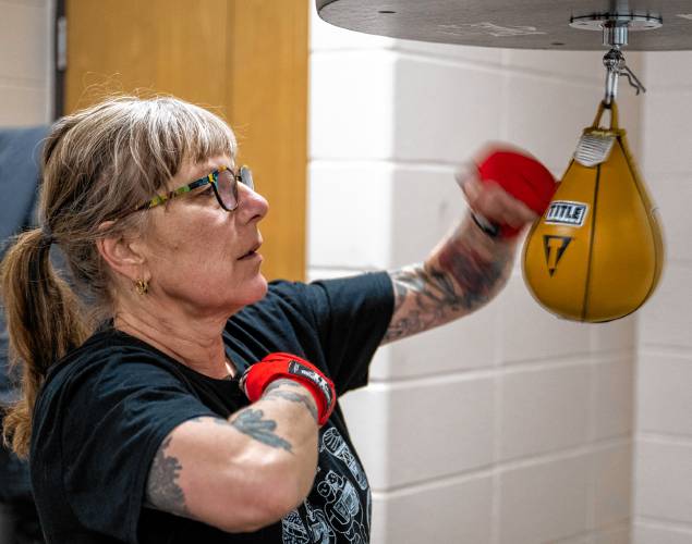 Nina Rossi trains on a speed bag during a women’s boxing class at Franklin County’s YMCA.