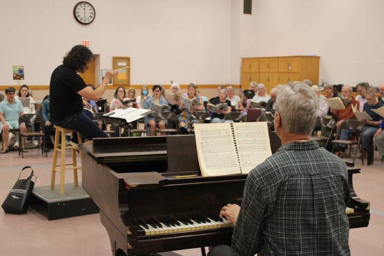Members of the Pioneer Valley Symphony rehearse at Most Holy Redeemer Church in Hadley in advance of the Saturday, April 26, performance at Greenfield High School that will conclude the symphony’s 86th season.