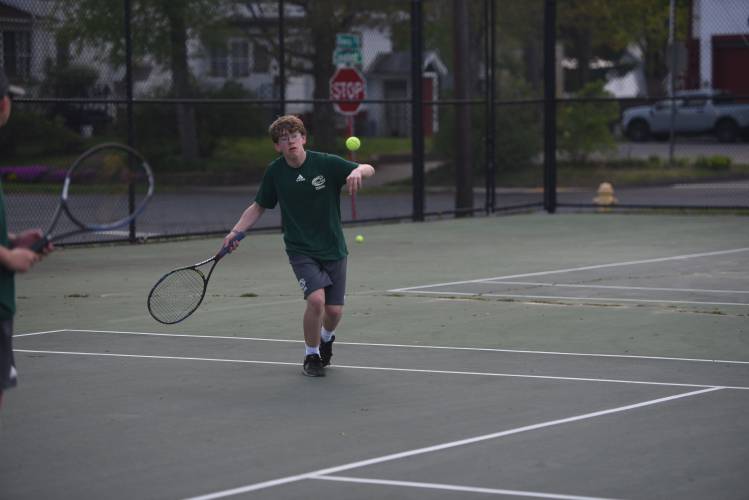 Greenfield's Noah Chambers returns a volley in No. 1 doubles against Frontier at the Davis Street Courts Friday. 