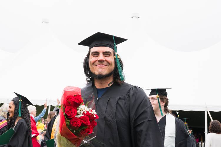 A Greenfield Community College graduate is all smiles at Saturday’s commencement ceremony.