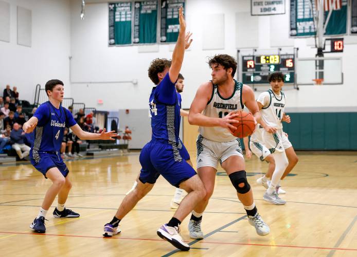 Greenfield’s Jonathan Breor (11) maneuvers under pressure from Wahconah’s Sam McLaughlin (24) in the second quarter Saturday night in Greenfield.