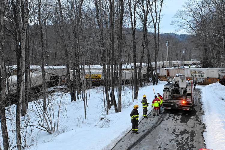 Fifteen railroad cars that derailed in Wendell Tuesday afternoon rest bunched up across the tracks parallel to Farley Road, with one freight car blocking Farley Road.