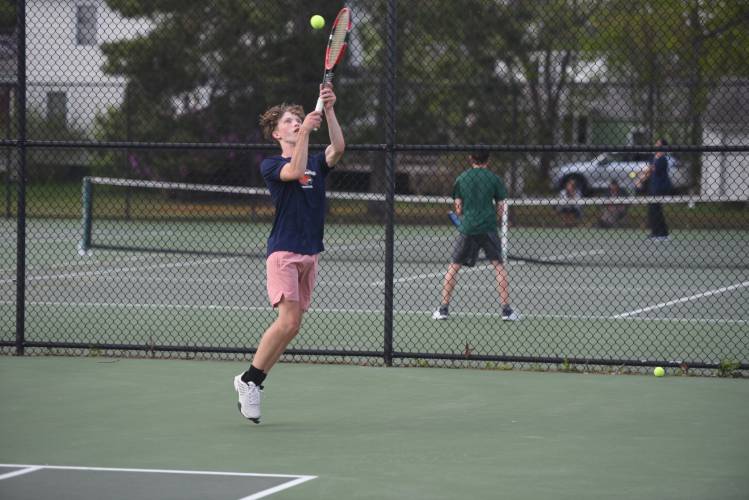 Frontier's Noah Nichols returns a volley in No. 1 doubles against Greenfield at the Davis Street Courts Friday. 