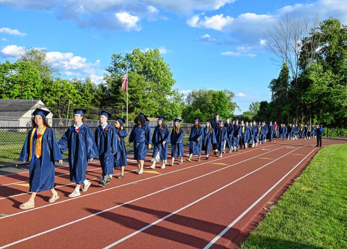 Seniors at Frontier Regional School process to graduation on Friday Night in South Deerfield.