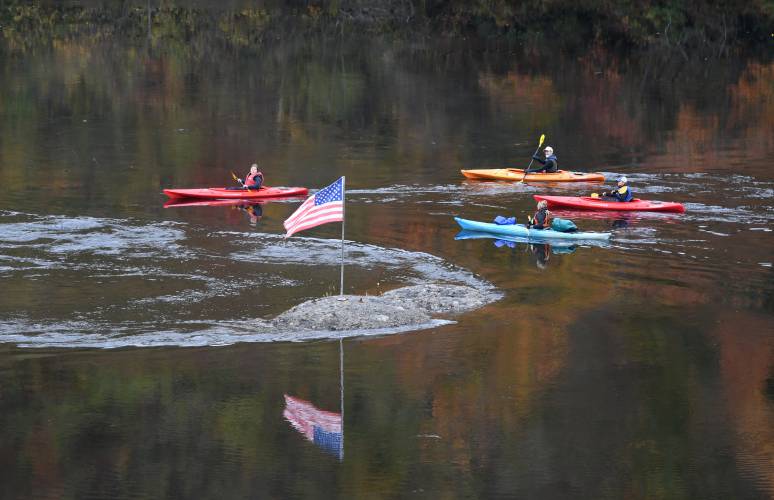 A group of paddlers passes the French King Rock adorned with an American flag on the Connecticut River in 2020. Gillbilly Paddle organizers are hoping for fair weather to take to the Connecticut River on Saturday, July 13. A group of paddlers passes the French King Rock adorned with an American flag on the Connecticut River in 2020. Gillbilly Paddle organizers are hoping for fair weather to take to the Connecticut River on Saturday, July 13.
