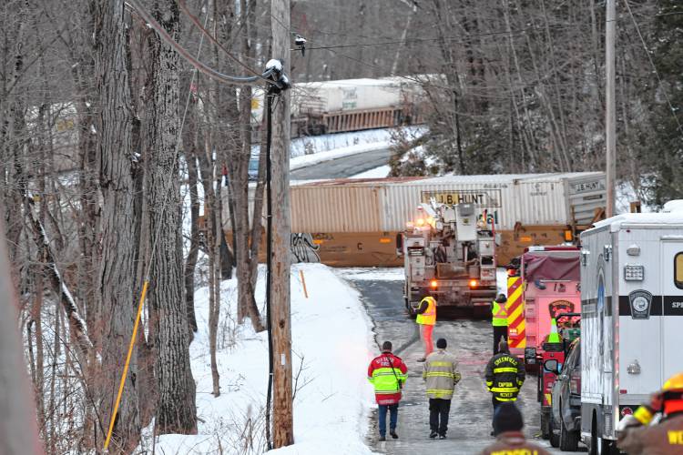 Freight train cars are strewn across the tracks parallel to Farley Road in Wendell, with one freight car blocking Farley Road Tuesday afternoon.