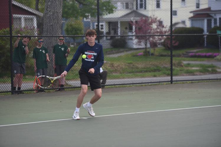 Frontier's Xavier Fripp returns a shot in No. 1 doubles against Greenfield at the Davis Street Courts Friday. 