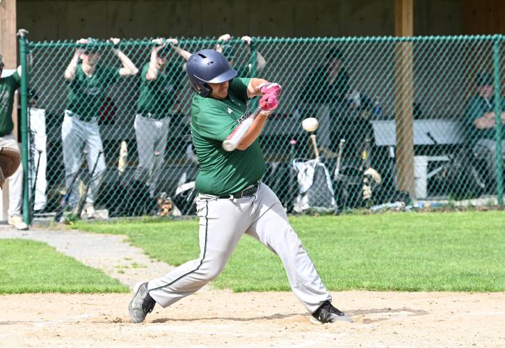 Greenfield’s Urijah Jenness puts the ball in play against Pioneer at Vets Field Wednesday.