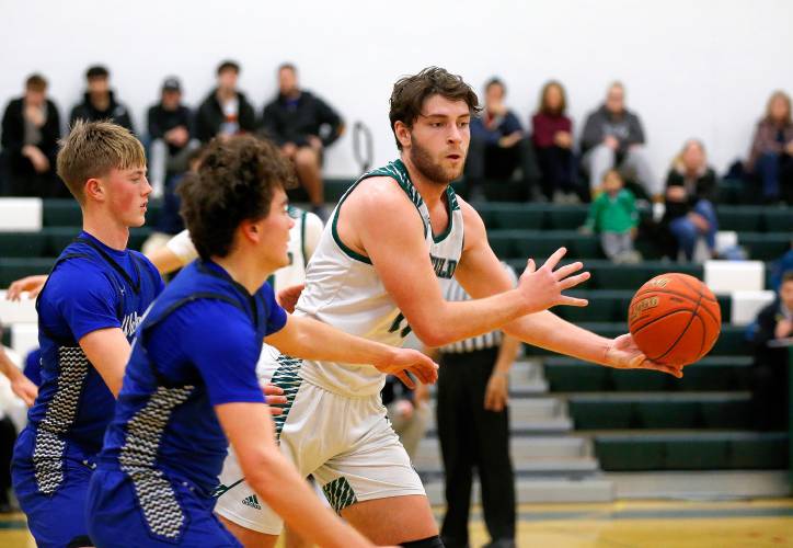 Greenfield’s Jonathan Breor (11) hands off a pass against Wahconah in the second quarter Saturday night in Greenfield.