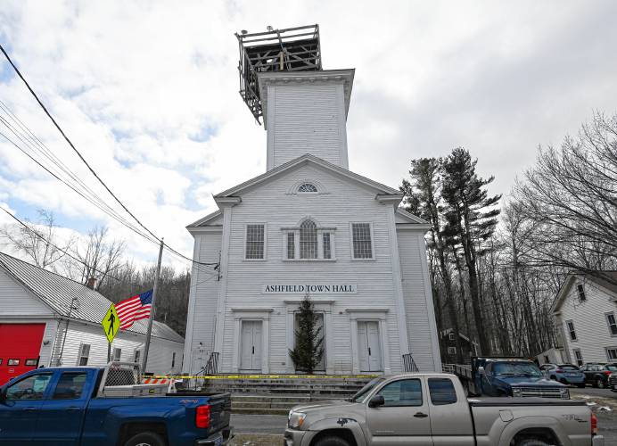 Ashfield Town Hall is surrounded by caution tape on Friday as the temporary structure on the tower, where the cupola was removed, shifted amid heavy winds.