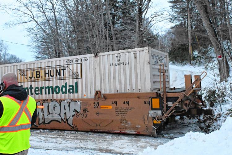 A freight train car rests across Farley Road, also blocking a driveway in Wendell Tuesday afternoon.