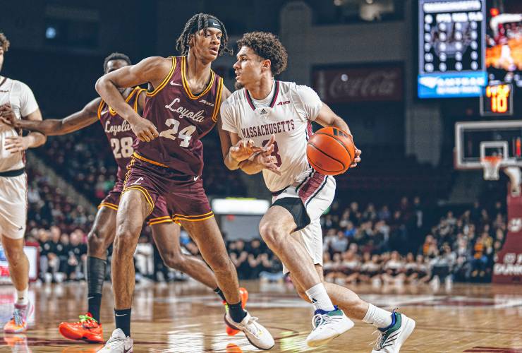 UMass sophomore guard Marqui Worthy (3) drives to the basket during the first half of the Minutemen’s 00-00 loss to Loyola Chicago on Saturday afternoon at Mullins Center in Amherst.
