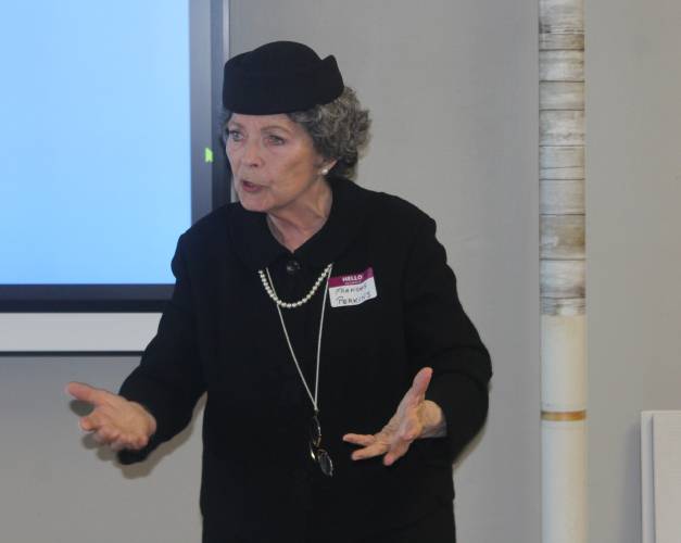 Actress and University of Massachusetts Amherst Professor Emerita Jarice Hanson performs as Frances Perkins, a Massachusetts native and Mount Holyoke College graduate who became the first woman ever to serve in a presidential cabinet, during an open house at The Literacy Project’s Orange location on Thursday.