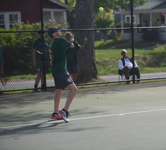 Greenfield's Ben Russell returns a shot in No. 1 doubles against Frontier at the Davis Street Courts Friday. 