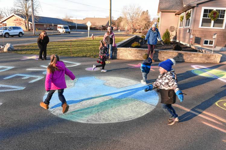 Sharon Bordeaux, who lives on Pleasant St. across from the Deerfield Elementary School, makes sidewalk chalk art in her driveway every Friday morning.