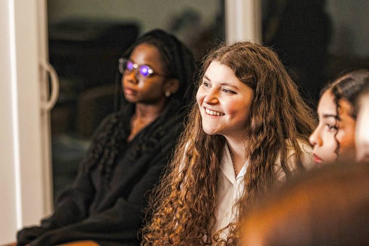 Zoë Naughton-O'Connor a junior at Stoneleigh-Burnham School, listens to Caitlin Kinnunen speak to the cast of 