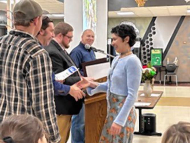 Amy Rodriguez from Orange (center) receiving her certificate in welding and metal fabrication during the Franklin County Technical School Career Technical Institute’s fall graduation ceremony on Thursday, Dec. 12. Amy Rodriguez from Orange (center) receiving her certificate in welding and metal fabrication during the Franklin County Technical School Career Technical Institute’s fall graduation ceremony on Thursday, Dec. 12.