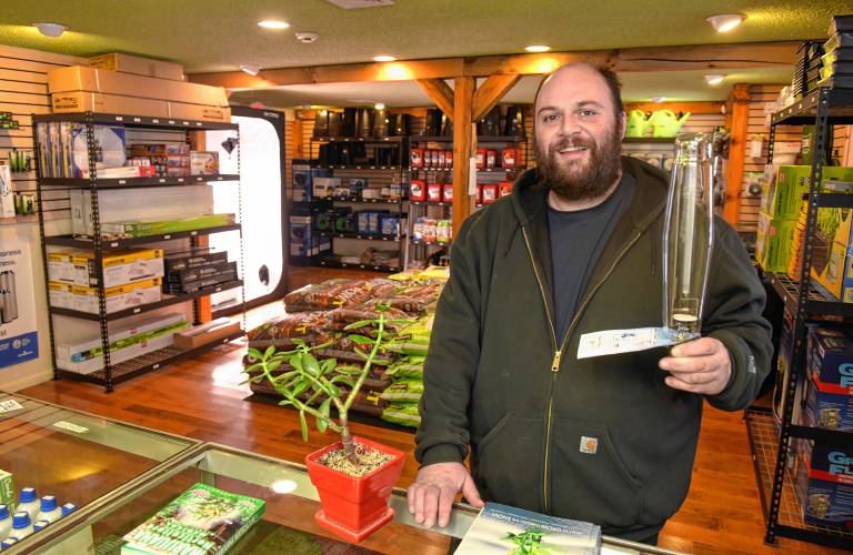 Wilder Sparks of Hilltown Growers Supply on Route 2 in Shelburne holds up a grow bulb in his store in the Arrowhead Shops. January 11, 2018.