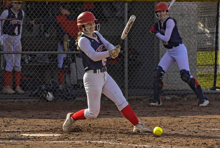 Frontier’s Ashley Taylor (6) puts the ball in play against Agawam during the Redhawks’ season opener on Friday at Zabek Field in South Deerfield.