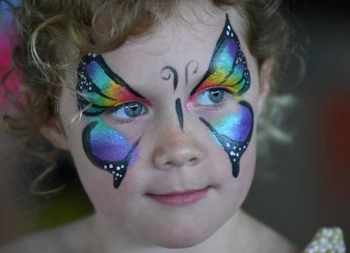Eleanor McCarthey, 6, of Newport RI, had her face painted on Saturday at the Green River Festival at the Franklin County Fairgrounds.