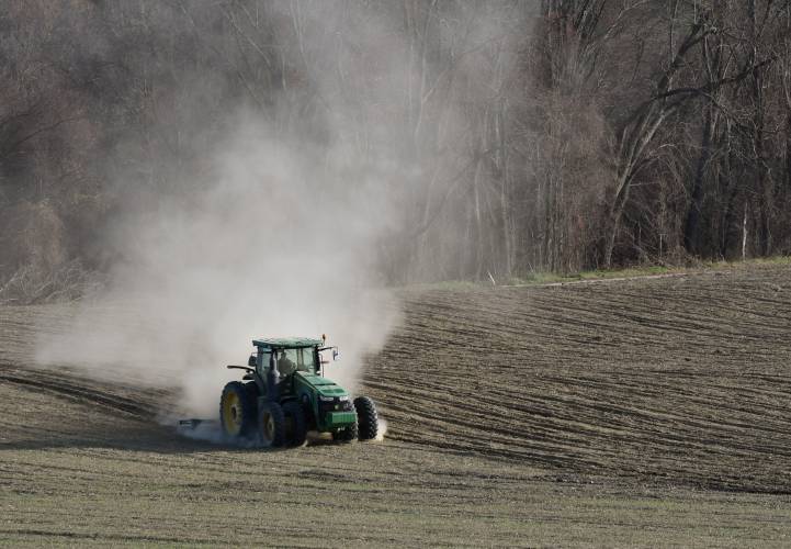 A tractor kicks up a cloud of dust in Gill. Pioneer Valley migrants and advocates say that a crackdown on immigration could lead to less of a selection of food and food prices increasing because a lot of what’s grown in Massachusetts stays here. A tractor kicks up a cloud of dust in Gill. Pioneer Valley migrants and advocates say that a crackdown on immigration could lead to less of a selection of food and food prices increasing because a lot of what’s grown in Massachusetts stays here.