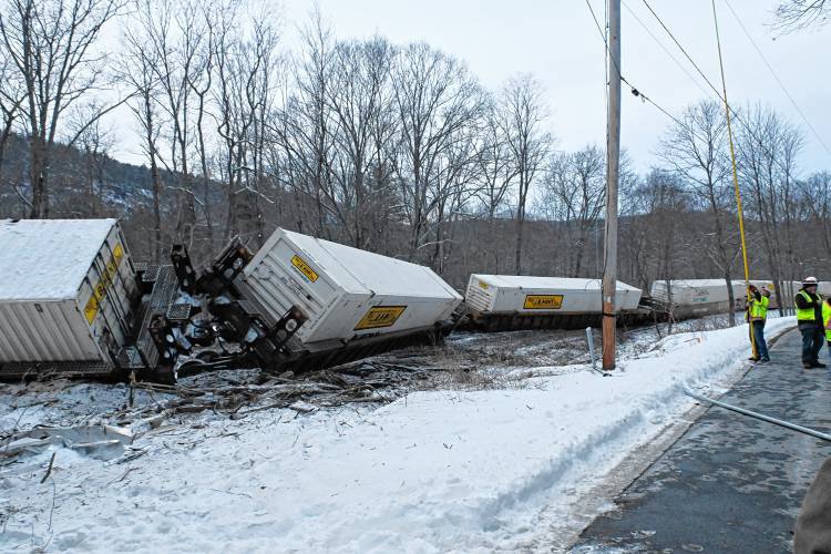 Freight train cars are strewn across the tracks parallel to Farley Road in Wendell on Tuesday afternoon. 