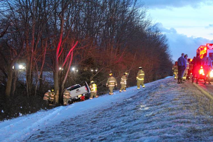 Firefighters and State Police troopers respond to a single-vehicle crash along Interstate 91 Friday evening that injured a 53-year-old Chicopee man.