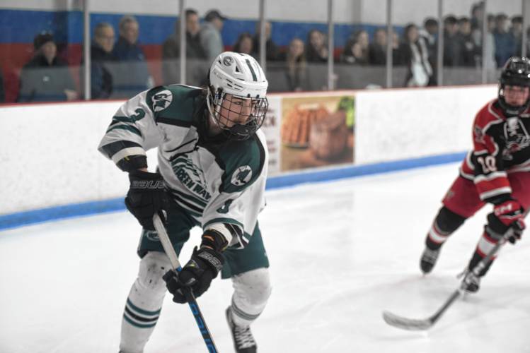 Greenfield's Shawn Beckwith corrals the puck against Westfield on Saturday during the Western Mass. Class A championship game at Olympia Ice Center. 
