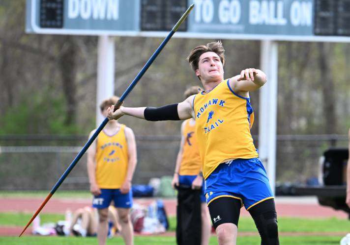 Mohawk Trail’s Crimson Helenek  tosses the javelin in South Deerfield on Tuesday. 