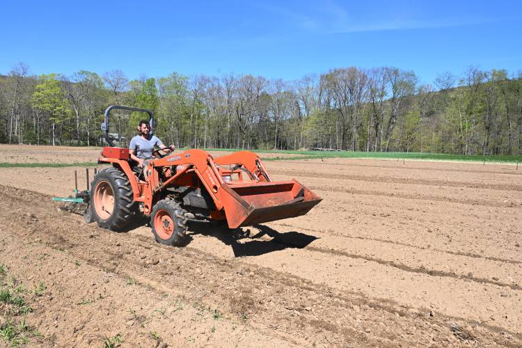 Dan Greene of Good Bunch Farm in Shelburne Falls prepares a field for planting.