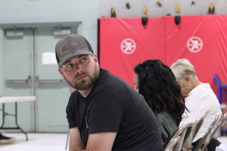Jeff Neilsen listens to speakers at annual Town Meeting.
