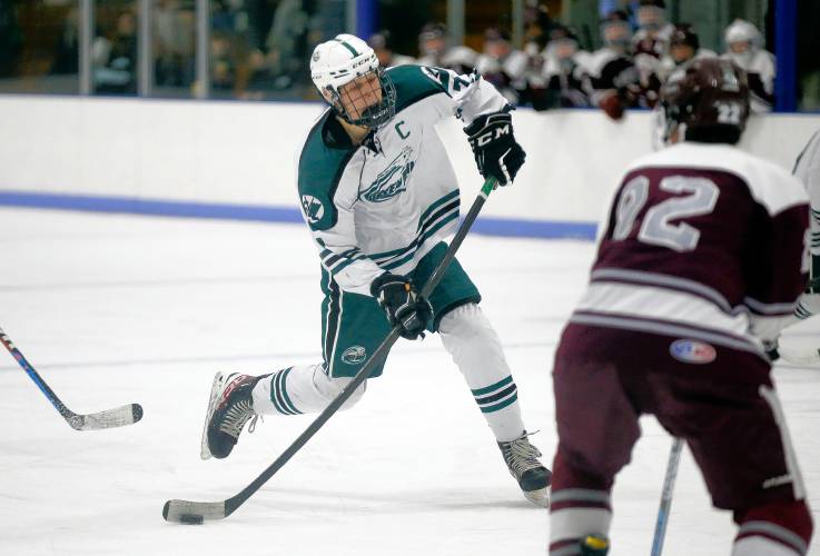 Greenfield’s Hunter Smith (7) fires a shot against Easthampton in the second period Saturday night at Collins-Moylan Arena in Greenfield.