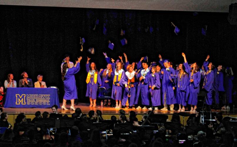 Thirty-seven graduation caps flew through the air Friday evening at Mohawk Trail Regional School’s Class of 2024 graduation ceremony. 