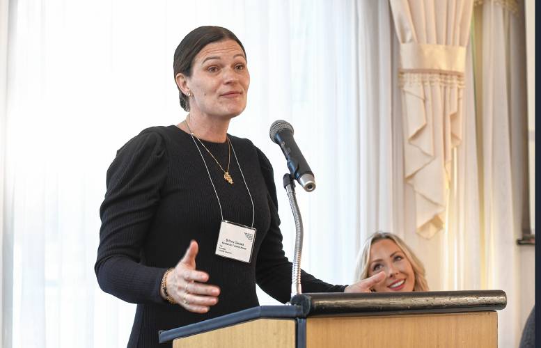 Britney Gioules of Kostanski Funeral Home speaks at the Franklin County Chamber of Commerce breakfast at Terrazza Ristorante in Greenfield Friday morning.