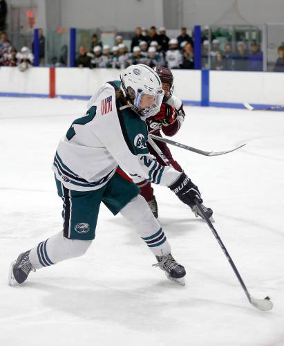 Greenfield’s Jake Jurek (2) fires a shot against Easthampton in the second period Saturday night at Collins-Moylan Arena in Greenfield.