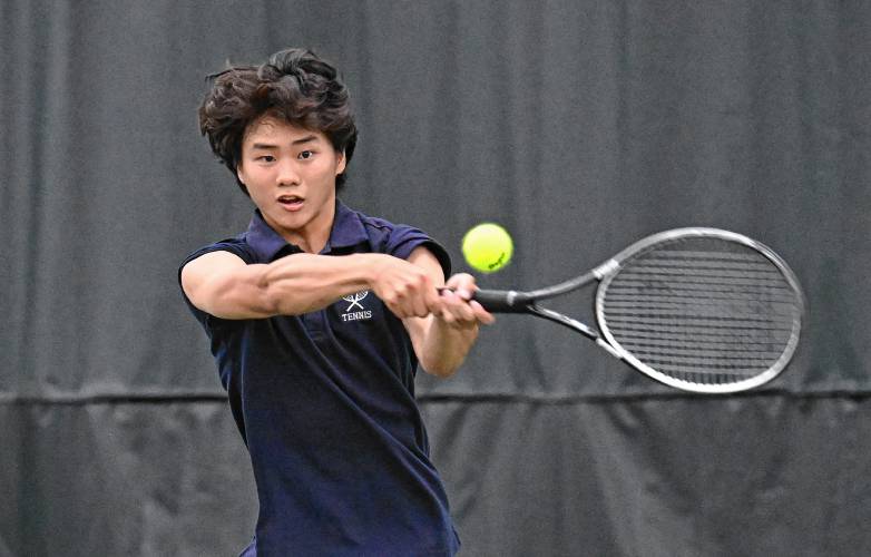 Frontier’s Jacob Han  returns a volley against Nantucket during an MIAA Div. 4 Round of 32 match at Deerfield Academy on Thursday. 