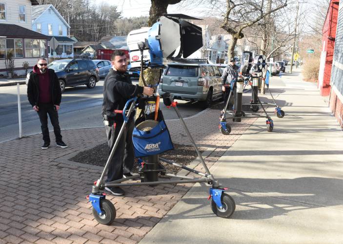 A film crew sets up lights to shoot a scene for the movie “Sheepdog” in Millers Falls in February 2023. The film will make its worldwide debut at the 40th Boston Film Festival on its opening night Sept. 20