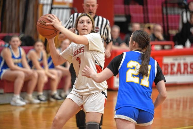 Athol's Maddie Desrosiers tries to get a shot off over Mohawk Trail's Bella Brown on Friday at Mallet Gymnasium in Athol. 