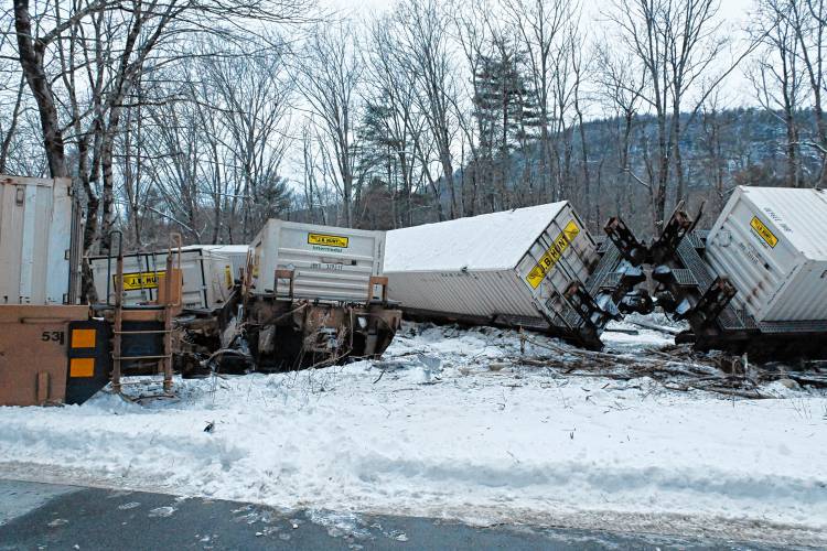 Freight train cars are strewn across the tracks parallel to Farley Road in Wendell on Tuesday afternoon.