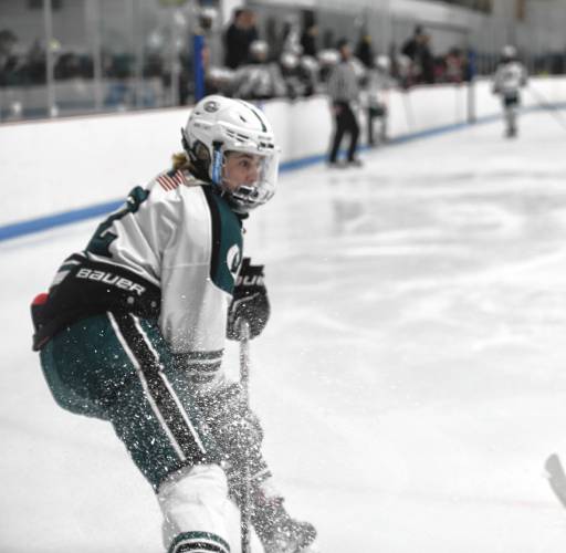 Greenfield's Jake Jurek hits the breaks before sending a pass back against Westfield on Saturday during the Western Mass. Class A championship game at Olympia Ice Center. 